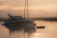 Misty morning peaceful setting of boats moored