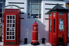 Old red telephone boxes and post box in New Zealand